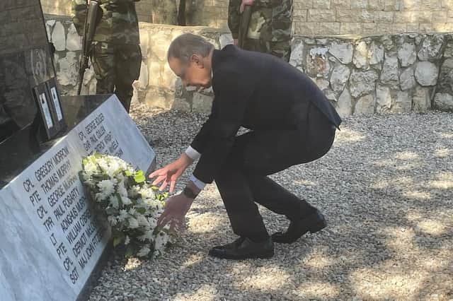 Tánaiste Micheál Martin laying a wreath for Private Seán Rooney at Camp Shamrock in Al-Tiri