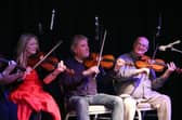 The late Dinny McLaughlin playing with Altan's Mairéad Ní Mhaonaigh and Ciarán Tourish, in the Glassworks in Derry in 2013. Photo Lorcan Doherty Photography