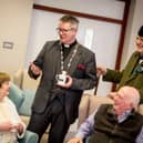 Archdeacon of Derry, Robert Miller chats to residents at Somme Park