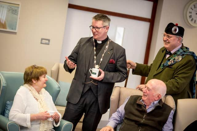 Archdeacon of Derry, Robert Miller chats to residents at Somme Park