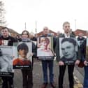 Families of the Bloody Sunday victims pictured previously with photos of their loved ones. Picture by Jonathan Porter/PressEye