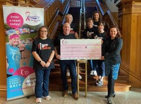 Legenderry Relay for Life committee members, including chairpersons,  Sean Hickey and Laura Moore,  presenting a cheque in the sum of £132,996 to Lisa Bailey, Cancer Research UK.