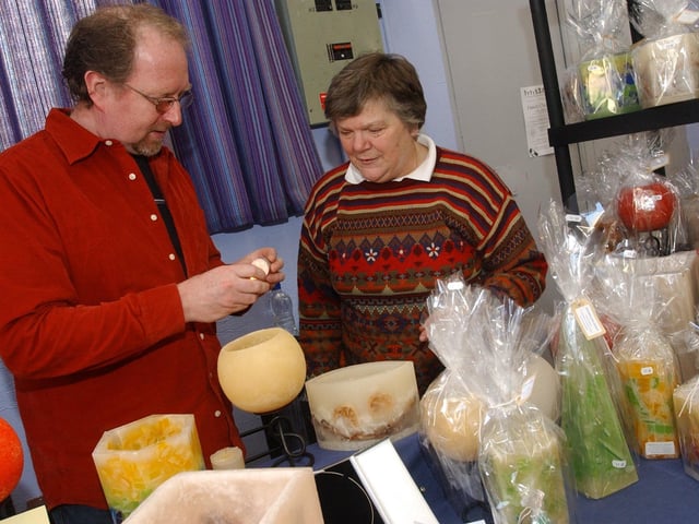 Paddy McGhee and Joan Doherty look over some of the items on sale. (2911PG05) : Christmas in Inishowen in 2005.