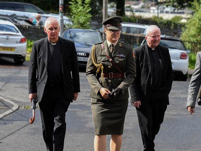 Fr Michael Canny PP, President Higgins’ Aide-De-Camp and Bishop Donal McKeown attend the Requiem Mass at the Long Tower Church for journalist and activist Nell McCafferty on Friday afternoon.  Photo: George Sweeney