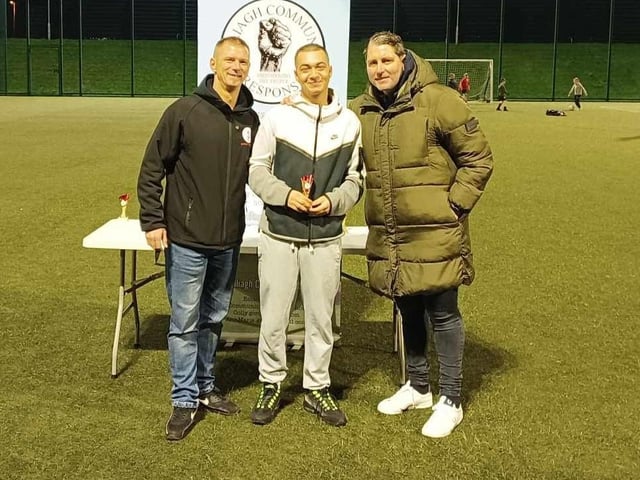 Keenan McMonagle collecting a participation trophy for Galliagh Utd.