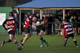 City of Derry’s David Graham, pictured taking on Cooke players last week, will miss this weekend's league trip to Dromore. Photo: George Sweeney
