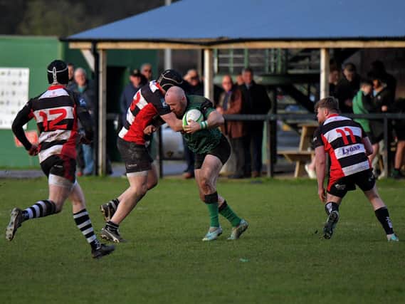 City of Derry’s David Graham, pictured taking on Cooke players last week, will miss this weekend's league trip to Dromore. Photo: George Sweeney