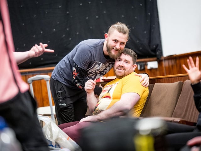 A hug before the wrestling and mayhem starts