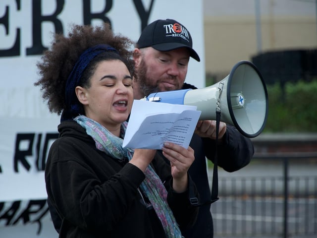 Local poet Abby Oliveira recites a poem.
