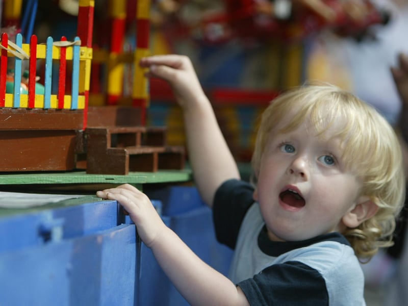 Young Jake Wilders asks can he take the miniature fairground home. (0107JB88)