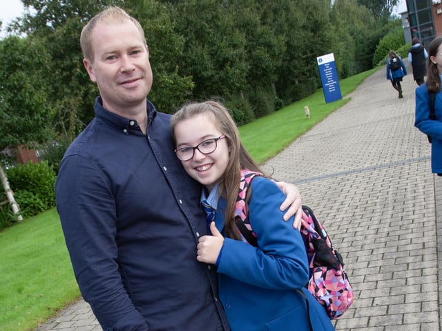 Year 8 student Amy Coyle pictured her dad Michael as he drops her off on her first day at St. Mary's College on Friday morning.