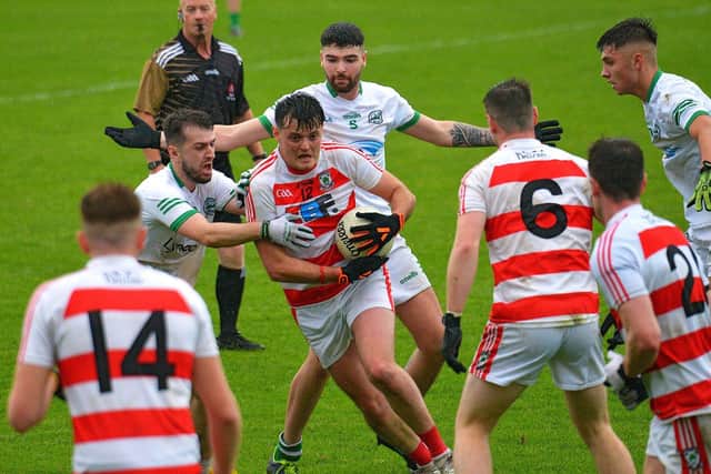 Craigbane’s Cahir O’Kane grapples with Ballerin’s Liam Brown during the JFC Final at Celtic Park on Sunday afternoon last. Photo: George Sweeney.  DER2241GS -33
