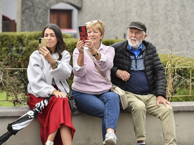 Spectators at the Muff Feile opening parade makes on Friday evening. Photo: George Sweeney