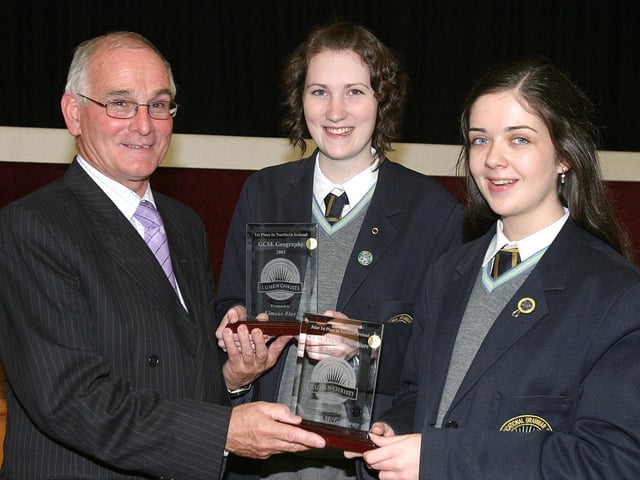 Eimear Blee (centre), collecting the award for 1st place in Northern Ireland in Geography and joint 1st place in Northern Ireland in English Literature with Mairead McGilloway, from guest speaker Declan O'Kelly at Lumen Christi College annual Prizegiving ceremony. (1411T01). :Lumen Christi College prizegiving ceremony in 2003