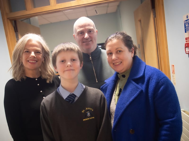 Mrs. Fiona Harrigan-Stewart, Vice Principal, St. Joseph's Boys School, welcoming St. Anne's PS pupil Aaron O'Kane and his mum and dad to the school on Tuesday night.