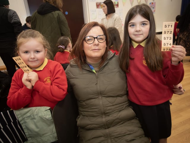 Tickets at the ready for Georgi White and Farrah McFarland as Farrah's mum Patricia awaits the draw at the Coffee Morning on Friday.