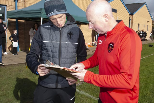 St. Joseph’s PE teacher Emmett McGinty and Event Co-Organiser Christy McGeehan (Phoenix Athletic FC, tournament hosts), sort out fixtures before the start of the Sean O’Kane Memorial Cup at St. Joseph’s on Saturday morning last. (Photos: Jim McCafferty Photography)
