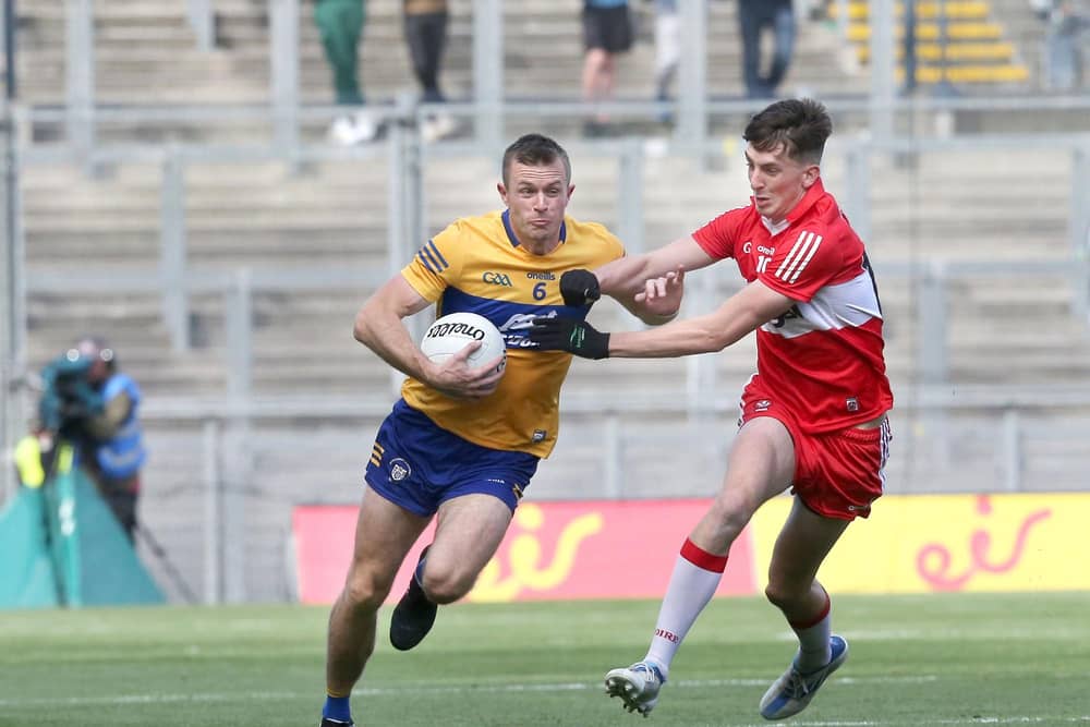 Derry's Paul Cassidy with Ciaran Russell of Clare during the All Ireland quarter final at Croke Park last June.