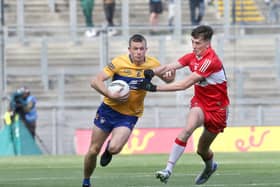 Derry's Paul Cassidy with Ciaran Russell of Clare during the All Ireland quarter final at Croke Park last June.