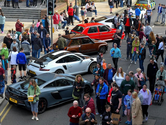 People visit the super cars and American Muscle cars that took part in the Bear Run from Derry’s Shipquay Street to Donegal and Inishowen, on Saturday morning, raising funds for Bumbleance, the Children’s Ambulance Service. Photo: George Sweeney. DER2317GS – 118