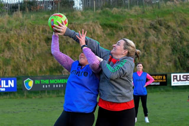 Action from Doire Trasna’s first Mothers and Others football practice session, at Corrody Road. Photo: George Sweeney.  DER2316GS – 13