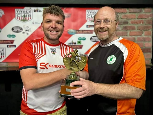 Lawrence Watson, Derry City Table Football Club, presenting the Jimmy Watson Memorial Cup to Kenny Beggs.