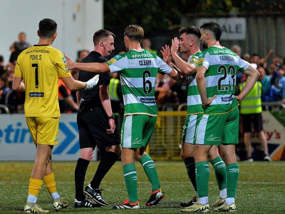 Shamrock Rovers players remonstrate with referee Damien McGraith after he awarded Derry City a late penalty. Photograph: George Sweeney