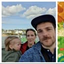 John Mackey with his partner Jemma Nic Lochlainn and their child Rowan. Kozie Moles artwork by Melissa Malone.