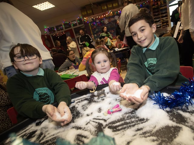 Having a ball with the snow is Ms. Freyja Gibson aided by Oakgrove P7 pupils Harley Grimsey and Mortan Feely. : .