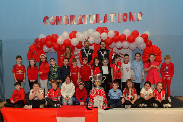 Derry City defenders Daniel Lafferty and Ciaran Coll pictured with Mrs McLeans  P4 class and the FAI Cup at St Eithnes Primary School on Wednesday morning. Photo: George Sweeney.  DER2246GS  083