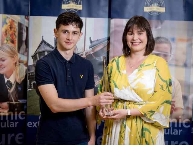 The DuPont Award for Chemistry is presented to Edan Bradley by Mrs Lynsey Campbell, (Head of Chemistry).