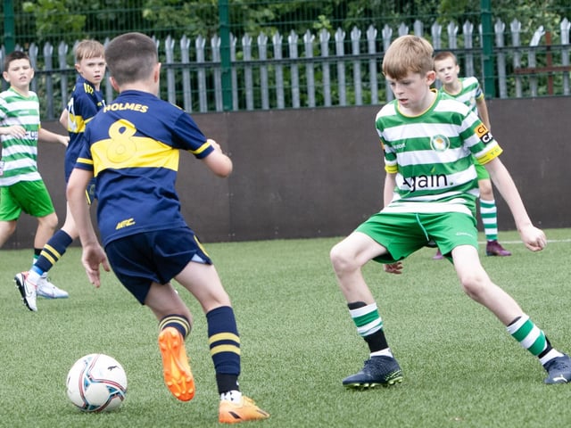 Action from one of the group games between Top of the Hill Celtic and Don Boscos.