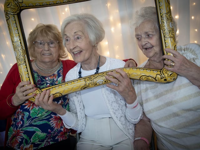 Ladies having some fun getting photos taken on Tuesday. : .