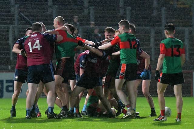 Scuffles between Doire Trasna and Glack players at half-time during Friday evening’s JFC quarter-final in Celtic Park. Photo: George Sweeney