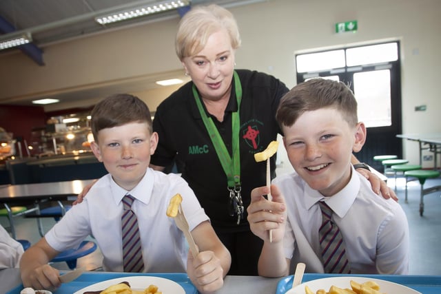 DOUBLE TROUBLE!. . . .St. Eugene’s PS twins Brandon and Tiernan Page pictured with Ms. McCallion during Tuesday’s Induction Day.