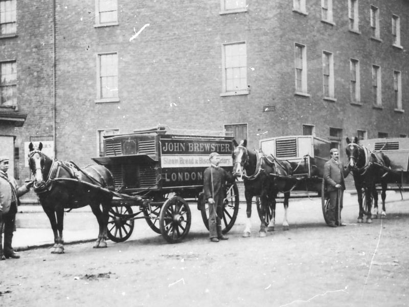 Employees of John Brewster & Sons Bakery, Great James Street, circa 1904, post for the photographer alongside their horse-drawn delivery van.