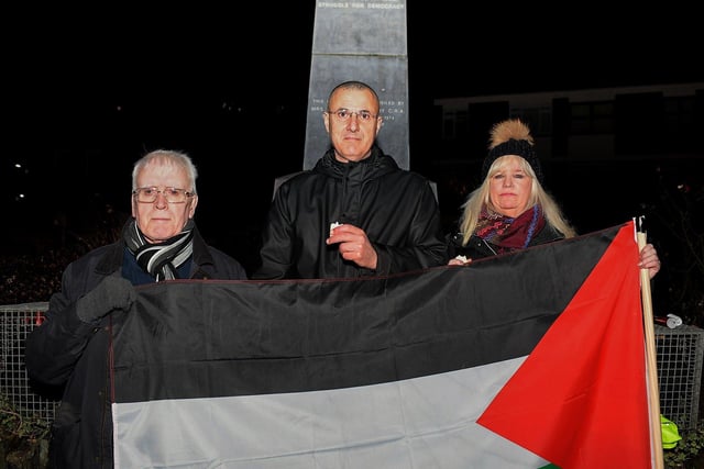 Omar Barghouti (centre), founding committee member of Palestine Campaign for the Academic and Cultural Boycott of Israel pictured with John Kelly and Maeve McLaughlin at a vigil for the children of Palestine held at the Bloody Sunday Monument on Rossville Street on Thursday evening. Photo: George Sweeney