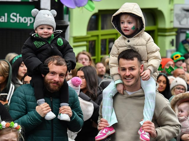 Derry City footballers Paul McMullan and Danny Mullen with their children at the St Patrick’s Day Parade. Photo: George Sweeney