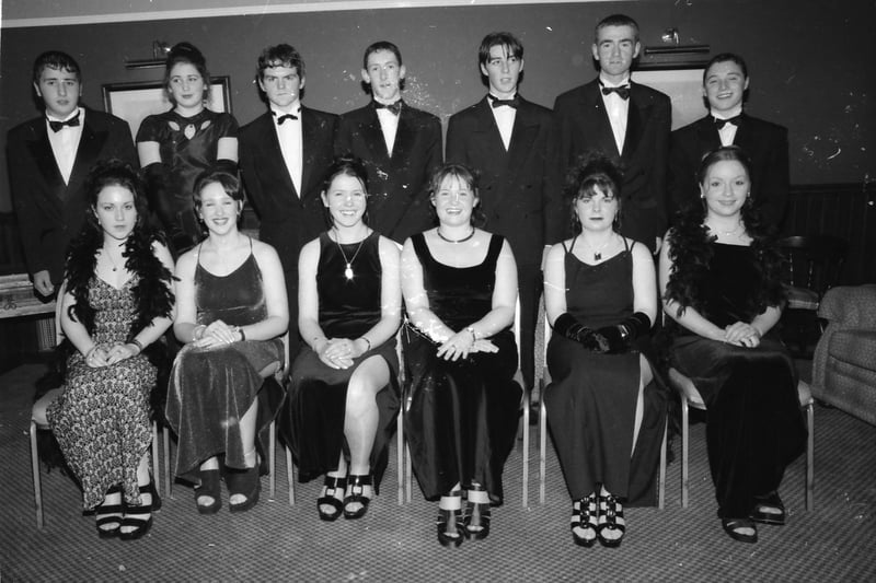 Seated, from left, Majella O'Kane, Orlaith McLaughlin, Margaret Ruddy, Fiona Cavanagh, Anita Lafferty and Marie-Therese McCallion. Standing, from left, Patrick Doherty, Susan McHale, Derek Harkin, Gavin McLaughlin, Kevin Bonner, Joe Lafferty and Robin Hutchinson. Pictured at the Carndonagh Community School formal in January 1998.