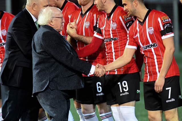 President Michael D, Higgins greets Derry City’s Michael Duffy at the Brandywell on Friday evening. Photo: George Sweeney. DER2307GS – 89