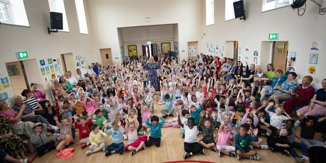 MICHELLE BOWS OUT!. . . .A packed assembly hall at Model Primary School on Friday last as retiring Principal, Mrs. Michelle Ramsey said her goodbyes. (Photos: Jim McCafferty Photograph)