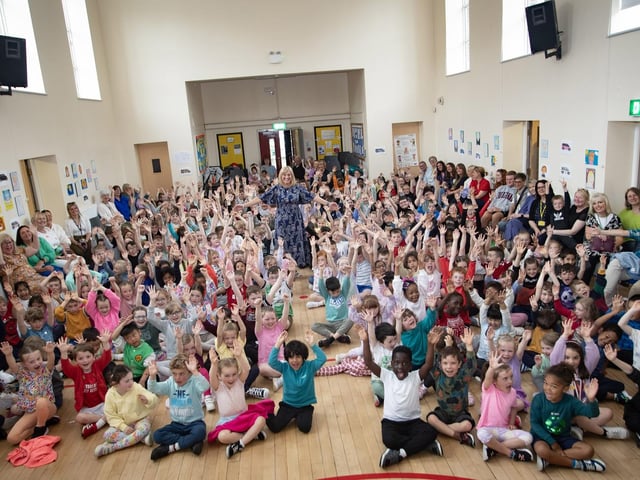 MICHELLE BOWS OUT!. . . .A packed assembly hall at Model Primary School on Friday last as retiring Principal, Mrs. Michelle Ramsey said her goodbyes. (Photos: Jim McCafferty Photograph)