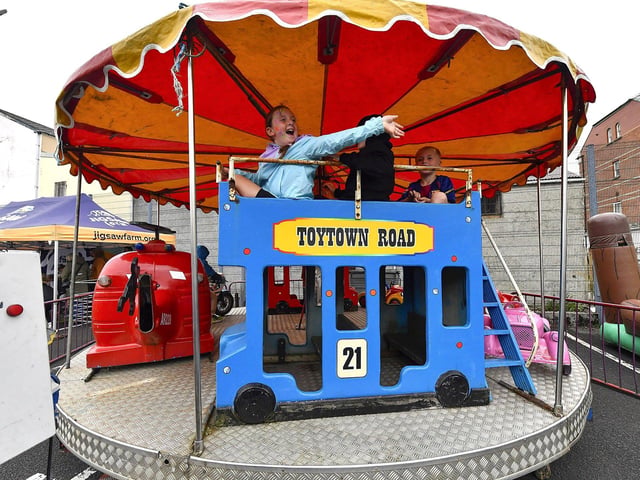 Enjoying a trip on the Carousel at the Gasyard Feile’s Big Bog BBQ held at Pilot’s Row Centre on Saturday afternoon. Photo: George Sweeney