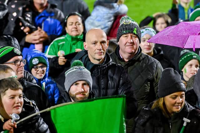 Danny and Newbridge manager Gary Hetherington watch as the John McLaughlin Cup is lifted. Photo by Oliver McVeigh/Sportsfile