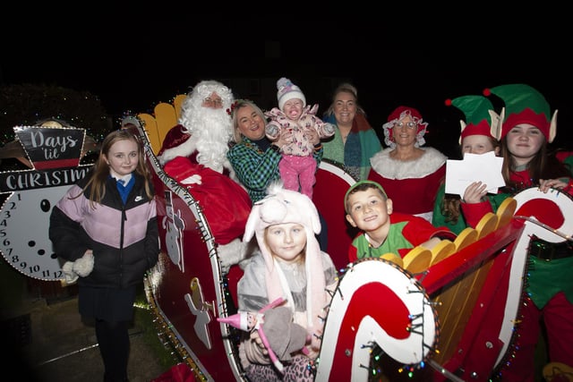The Mayor, Sandra Duffy on Santa’s Sleigh with Mrs. Claus, Elves, Ailbhe McDaid, Foyle Hospice and some of the children from Amelia Court, after Thursday’s Christmas Lights Switch-On.

