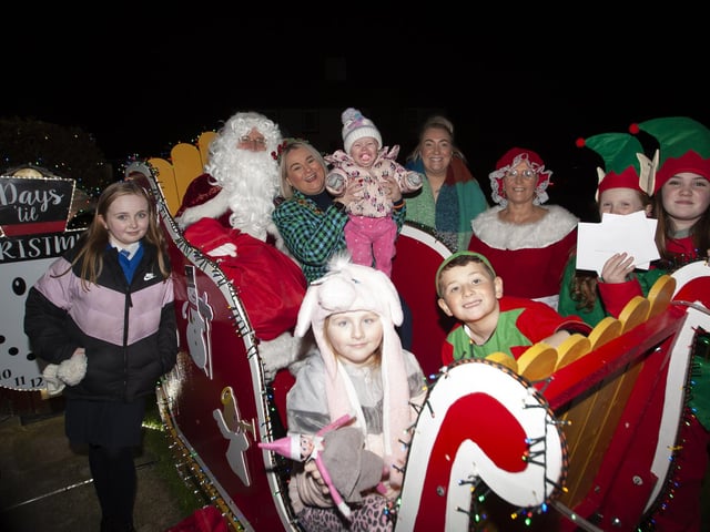 The Mayor, Sandra Duffy on Santa’s Sleigh with Mrs. Claus, Elves, Ailbhe McDaid, Foyle Hospice and some of the children from Amelia Court, after Thursday’s Christmas Lights Switch-On.
