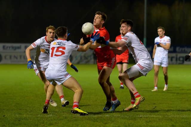 Tyrone players grapple with Derry’s Shane McGuigan during the Dr McKenna Cup game at Owenbeg on Wednesday evening . (Photo: George Sweeney )