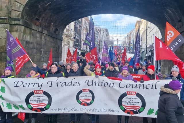 The trade union rally makes its way through Shipquay Gate.