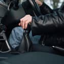 A driver changes gear.