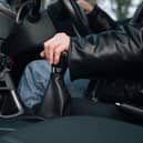 A driver changes gear.